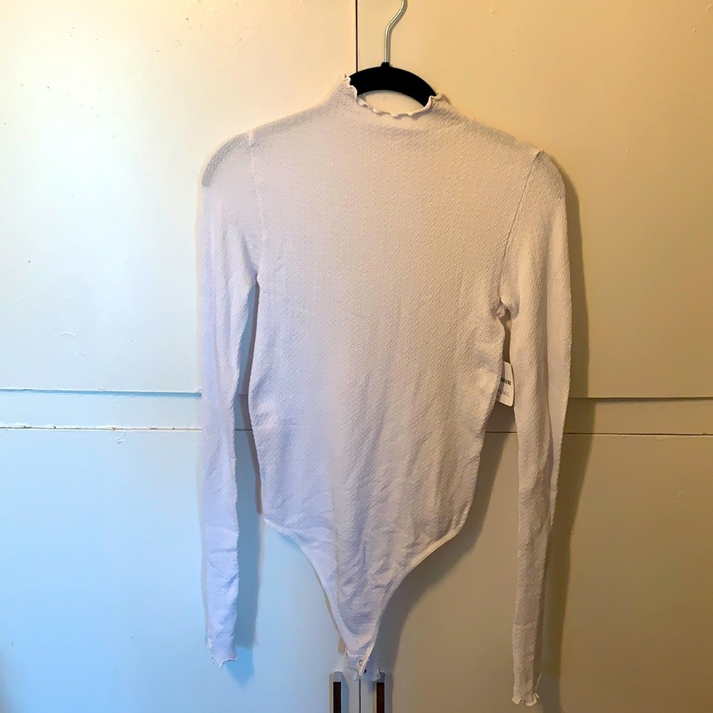 Brand new white long sleeve Free People bodysuit